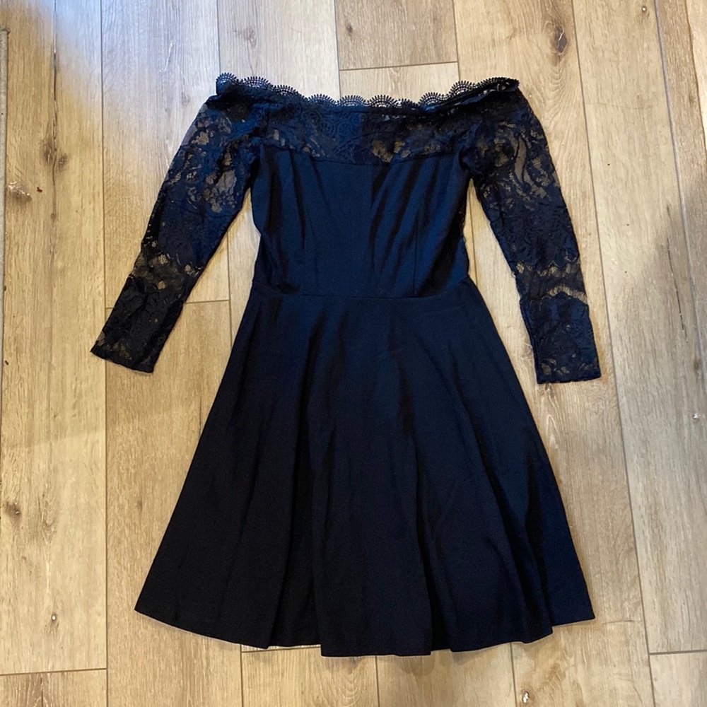 Gently worn. Across the shoulder, lace back, little black dress